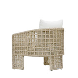 Woven chair with a white cushion on a white background