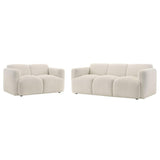 Beige sofa and armchair set on a white background
