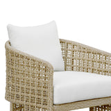Wicker chair with white cushions on a white background