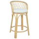 Rattan bar stool with a white cushion on a white background