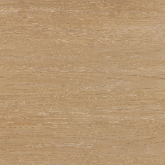 Close-up of a wooden surface with a light brown color and visible grain pattern.