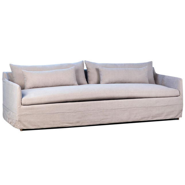 Beige sofa with cushions on a white background