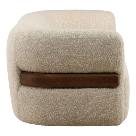 Beige cube-shaped ottoman with a brown band on a white background