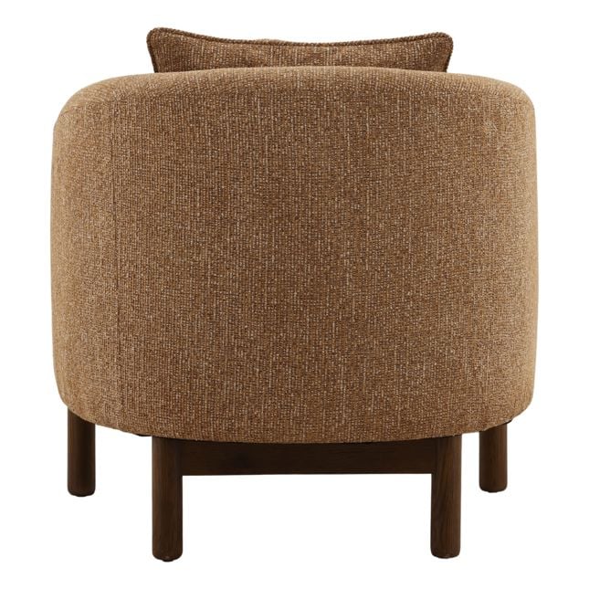 Brown upholstered chair with wooden legs on a white background