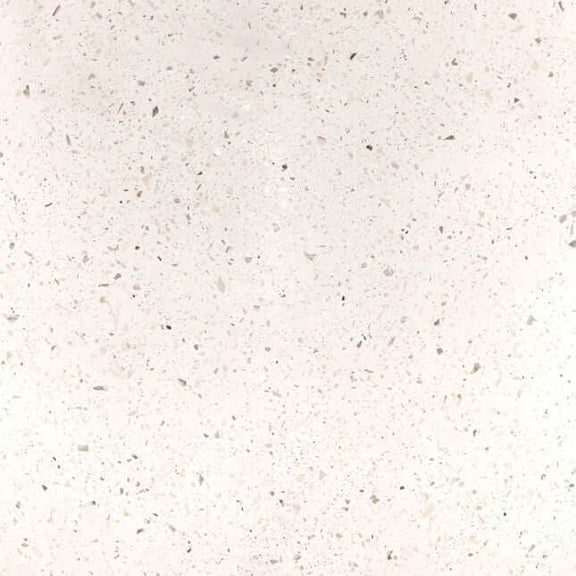 Close-up of a textured white surface with small specks