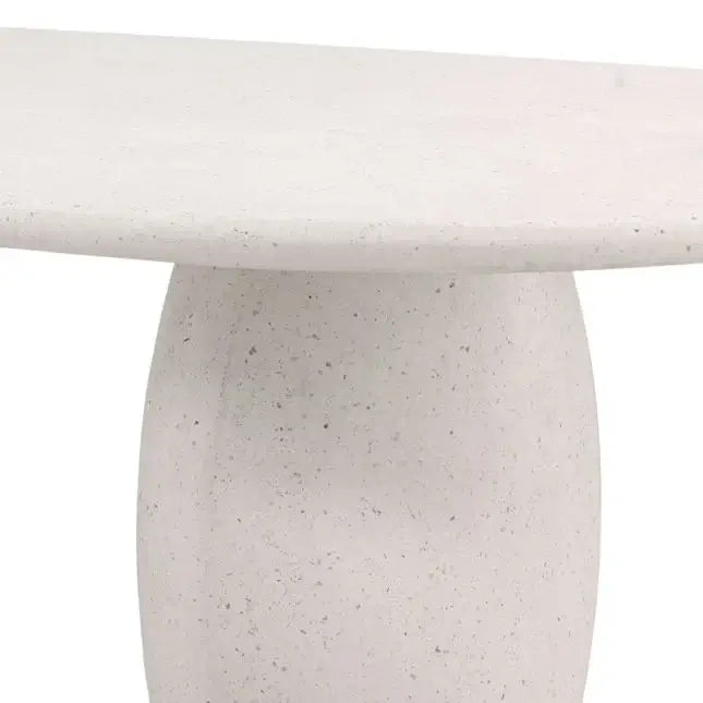 Close-up of a textured white table with a plain background