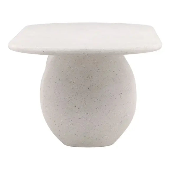 Small round stone table with a flat top on a white background