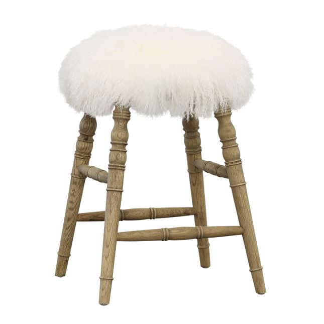 Bar stool with a white furry top and wooden legs on a white background