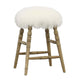 Bar stool with a white furry top and wooden legs on a white background