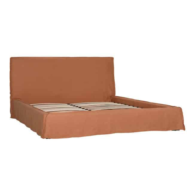 Brown upholstered bed frame on a white background