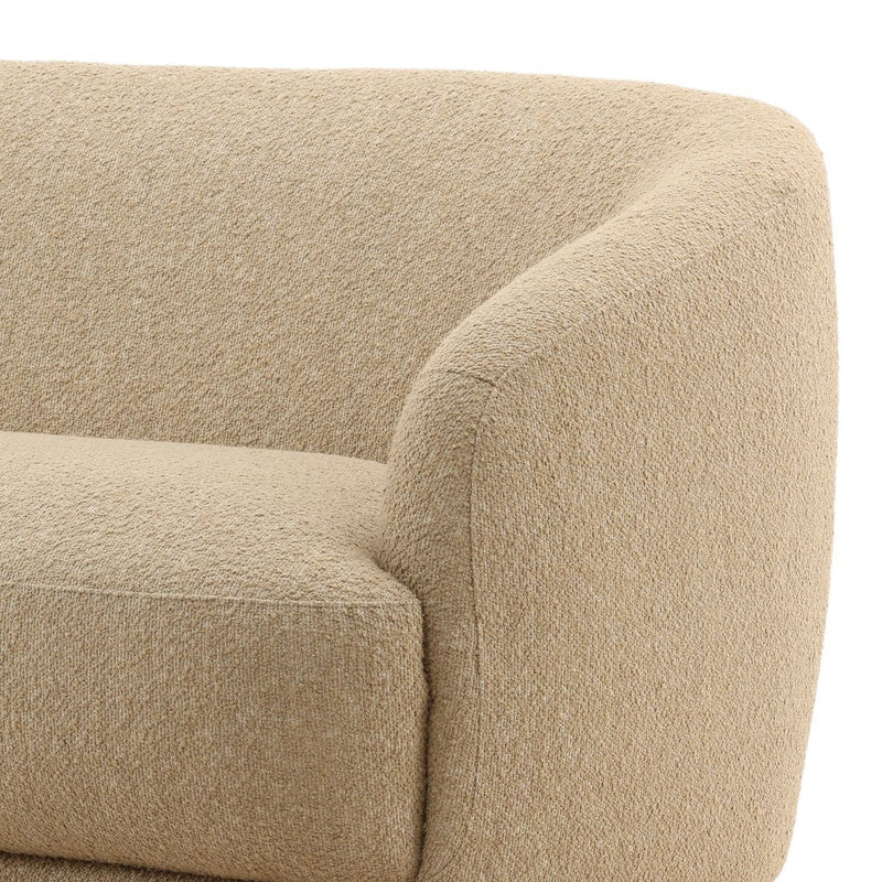 Close-up of a beige textured armchair corner on a white background