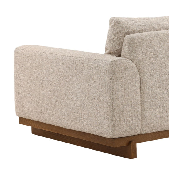 Beige sofa with wooden base on a white background