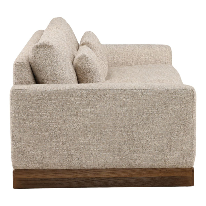 Beige sofa with wooden base on a white background