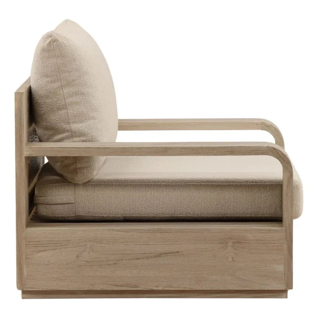 Beige armchair with wooden frame and cushion on a white background