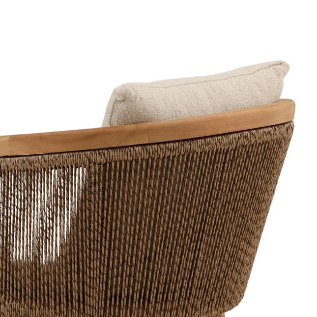 Close-up of a woven chair with a wooden armrest and beige cushion on a white background