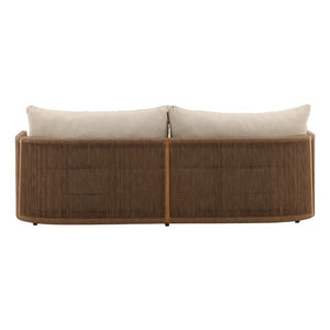 Brown wicker outdoor sofa with white cushions on a white background