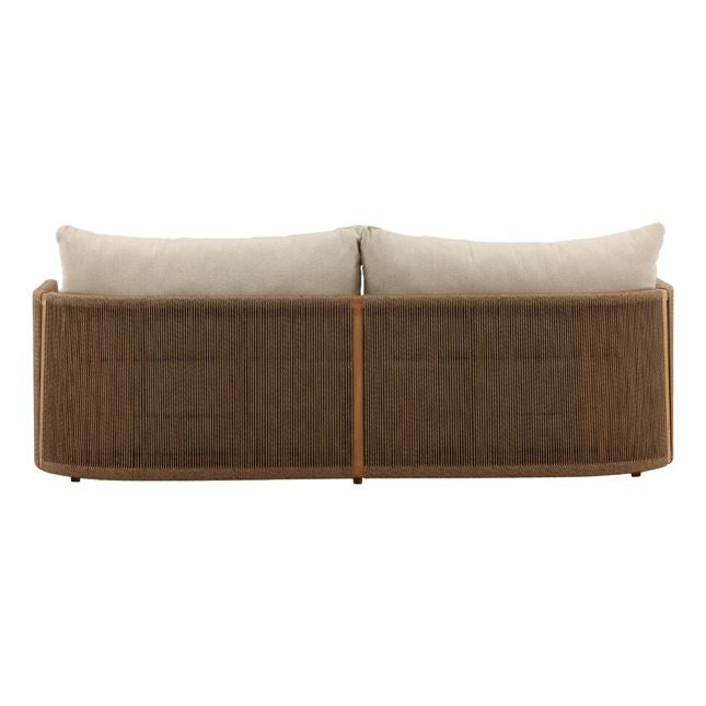 Brown wicker outdoor sofa with white cushions on a white background