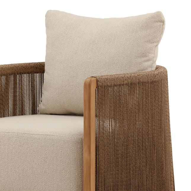 Beige cushion on a brown-framed chair with a white background