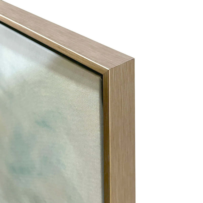 Close-up of a gold-framed mirror on a white background