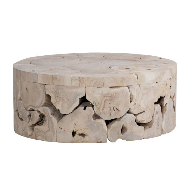 Round stone table with natural carvings on a white background