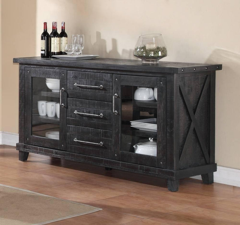 Dark wooden sideboard with glass doors and a countertop in a room setting.