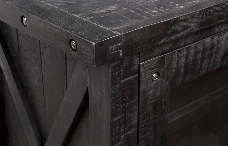 Dark wooden cabinet with metal accents on a dark background