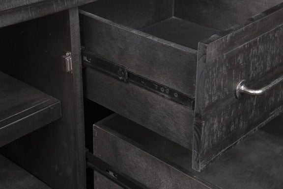 Dark wooden drawers with metal handles in a close-up shot
