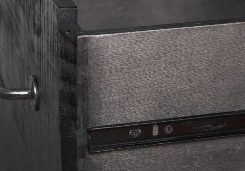 Close-up of a wooden door with metal handle and lock mechanism.