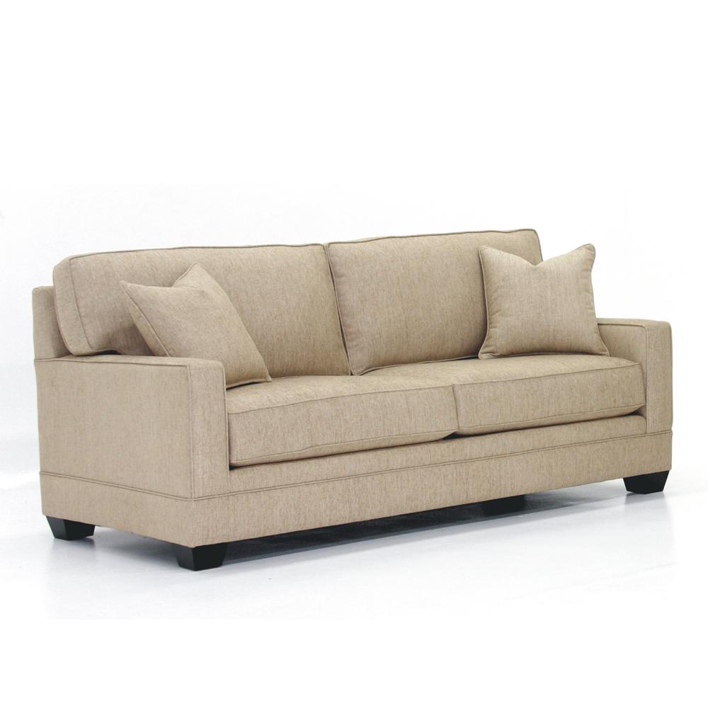 Beige sofa with three pillows on a white background