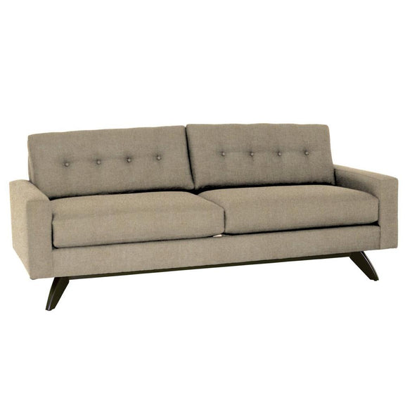 Beige sofa with buttoned backrest on a white background