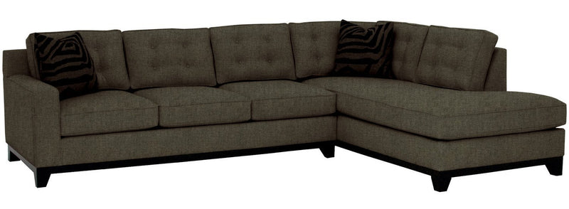 Brown sectional sofa with dark cushions on a white background