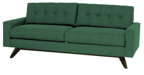 Green sofa with buttoned backrest on a white background
