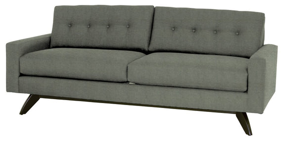 Gray sofa with buttoned backrest on a white background