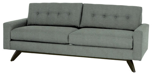 Gray sofa with buttoned backrest on a white background
