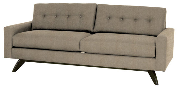Gray sofa with buttoned backrest on a white background
