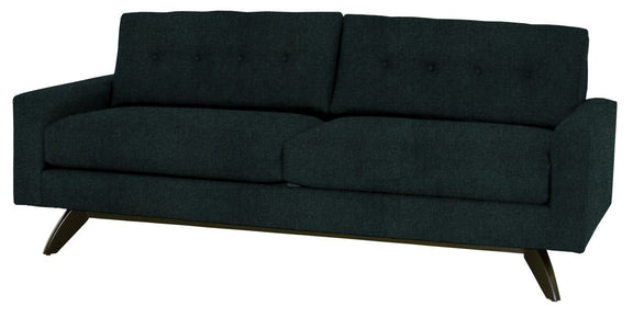 Dark green sofa with buttoned backrest on a white background